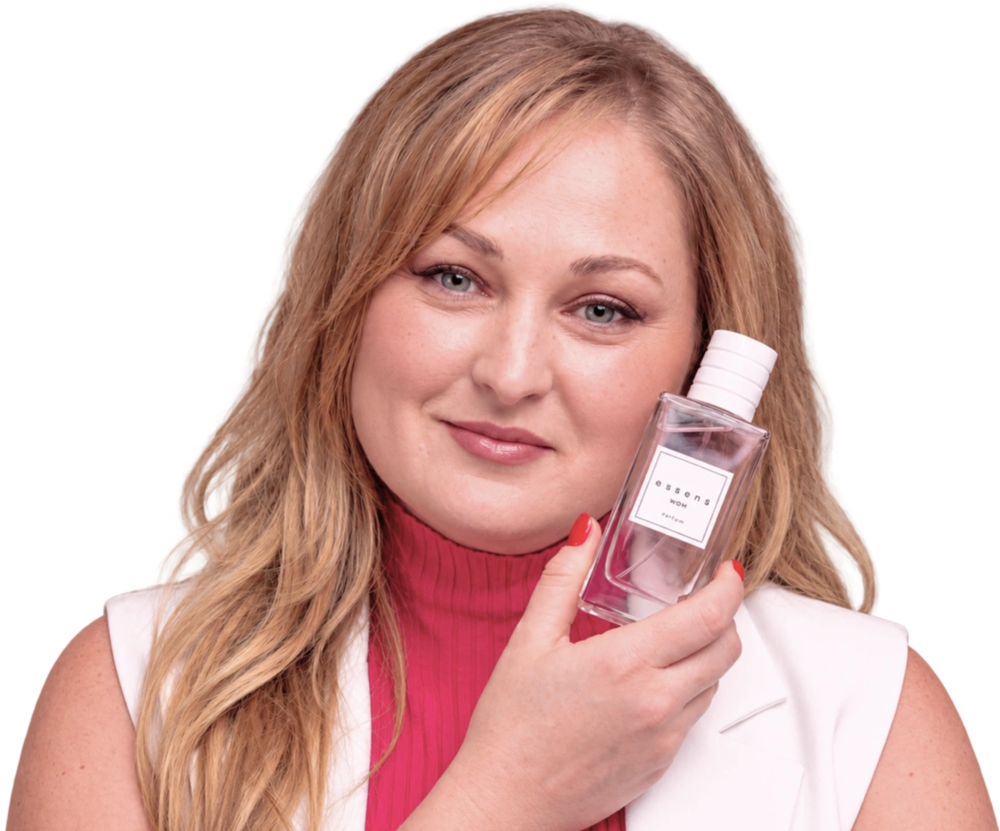 Valentyna Maskal, majitelka salonu, drží u tváře parfém Essens. Ilustrační foto upravené pomocí AI.
